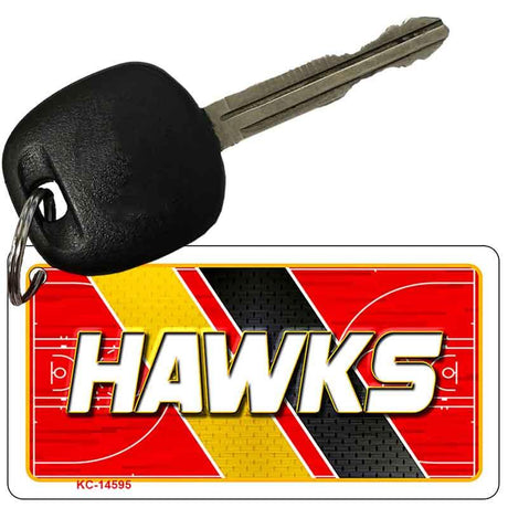 Key with a 'Hawks' keychain on a white background