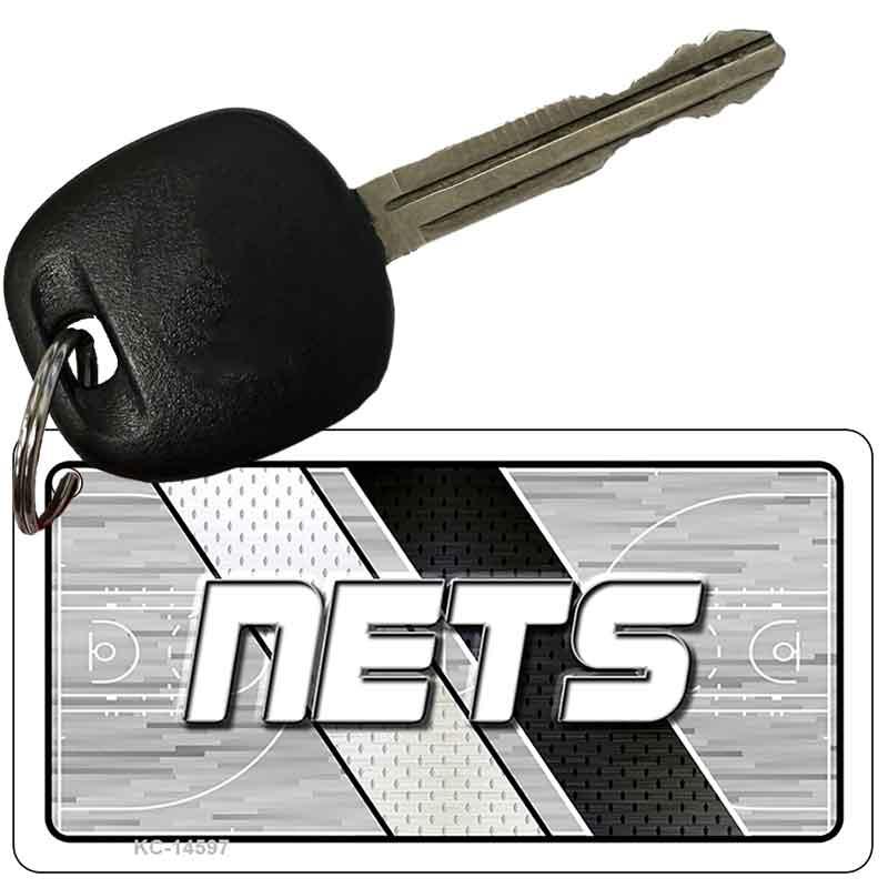 Key with a 'NETS' logo keychain on a white background