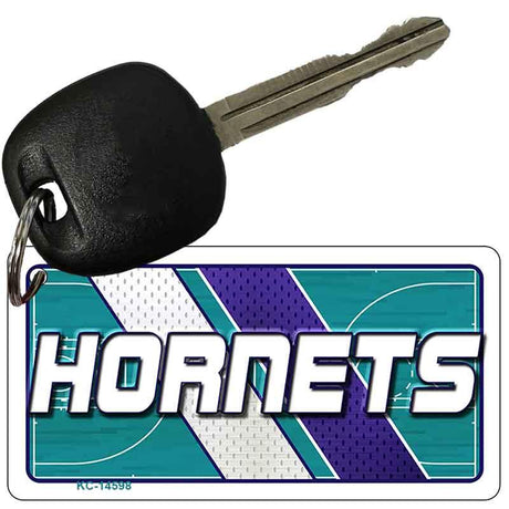 Key with a 'Hornets' logo keychain on a white background