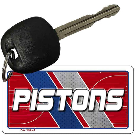 Key with a 'Pistons' keychain on a white background