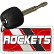 Key with a 'ROCKETS' keychain on a white background