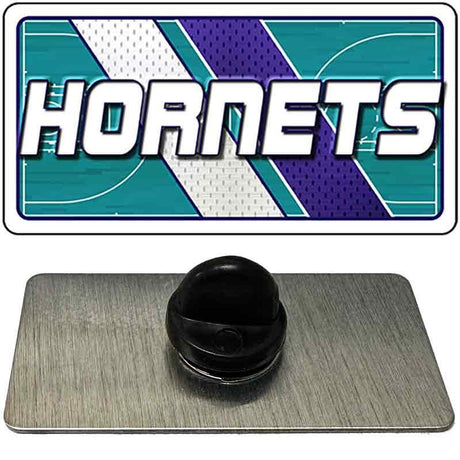 Black rubber stopper on a gray card with 'Hornets' logo in the background