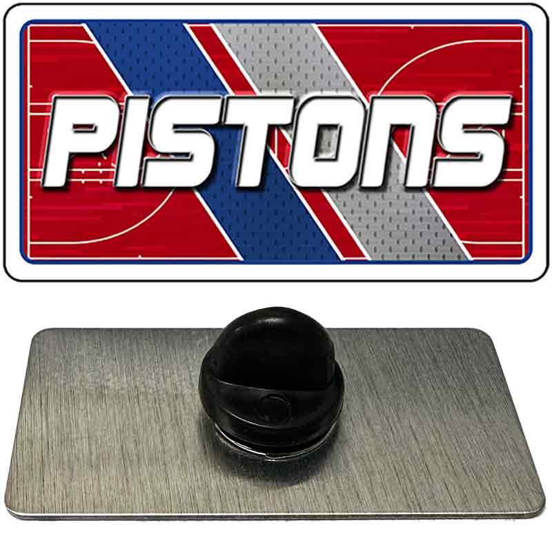 Metallic badge with 'PISTONS' logo on a red, white, and blue background