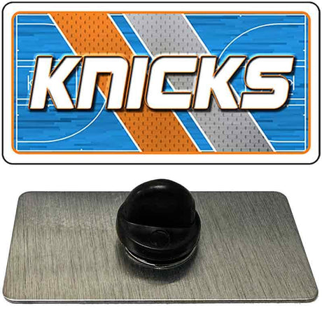 Metallic badge with 'Knicks' logo on a blue and orange background