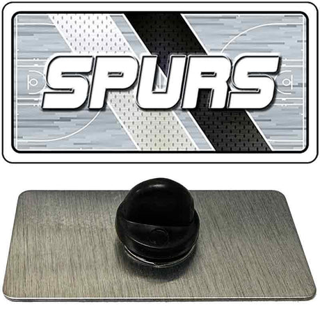 Black rubber stopper on a gray mat with 'SPURS' logo in the background